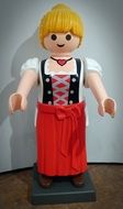 blonde woman in red skirt, plastic toy