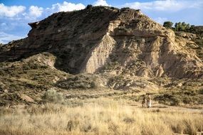 couple in love at the foot of the hill