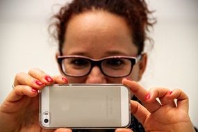 Woman is recording with Iphone