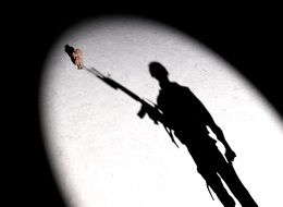 shadow of a female soldier with a gun