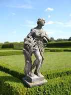 statue of the goddess of beauty in the green garden