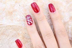 beautiful red manicure on a nails