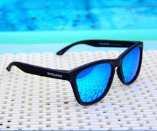 glasses with blue glasses on the surface