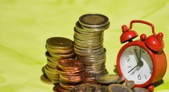 coins and red clock