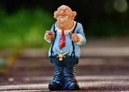 figurine of a happy man in the street