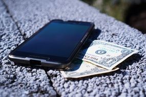 Money under mobile phone