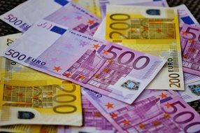 background in the form of euro banknotes on the table