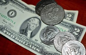 dollar bills and coins