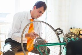 Man is repairing bicycle