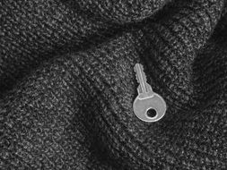 metal key on the wool fabric