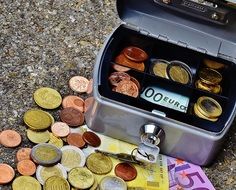 cashbox with euro coins and banknotes