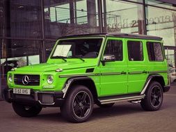 green mercedes on the road