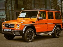 orange Mercedes benz car