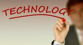 businessman and red lettering "technology"