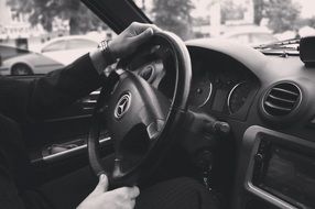 male hands on steering wheel of mercedes-benz car, Black And White