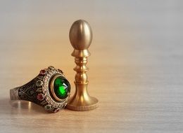 gold ring with green stone