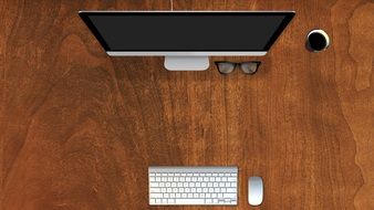 computer monitor, mouse, Keyboard and glasses on wooden table