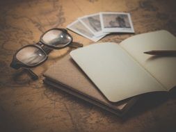 empty notebook and glasses