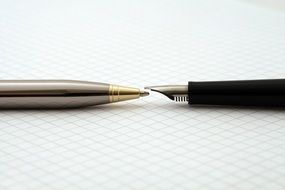 pens on a white surface