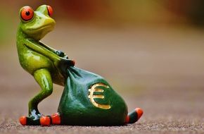 frog figure with a bag of money