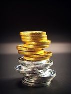 tower of gold and silver coins