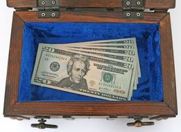 dollars in the wooden box
