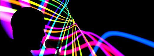 silhouette of a musician on the background of colored lines