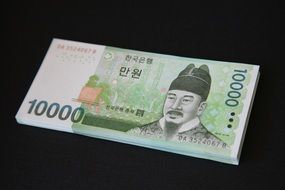 korean banknote on black background