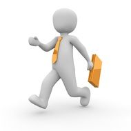 figurine of a person walking with a yellow folder