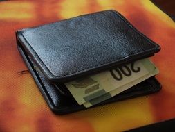 banknotes in a leather wallet