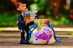figure of tax consultant and money box