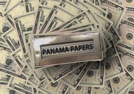 metal box on dollar bills