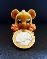 monkey figurine with euro coin