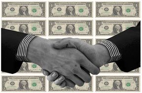 shaking hands on the dollars background