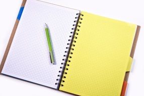 green pen on notepad