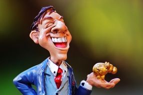 figure of businessman with money pig