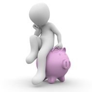 white man is sitting on the piggy bank