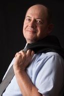 portrait of a businessman in a shirt on a black background