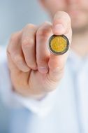 man holding coin