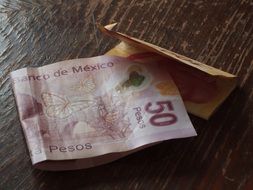 paper mexican money on the table