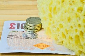 sponge and pound banknotes and coins