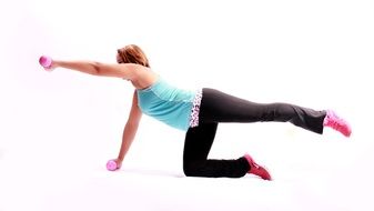 strong woman exercising with dumbbells