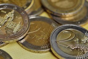 coins on a yellow surface