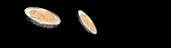 two euro coins at black background