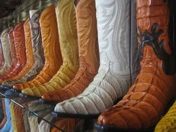 cowboy boots on a shelf in a store