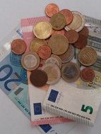 Euro banknotes and metal coins close-up