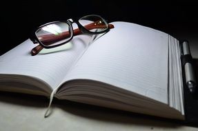Glasses on Notebook, stil life, Lenses in Focus