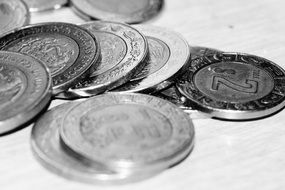gray coins on a white table