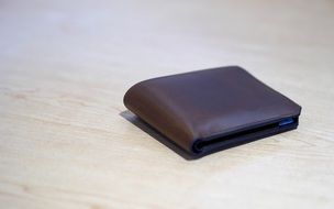 brown wallet on the table