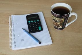 Calculator, Pen and coffee